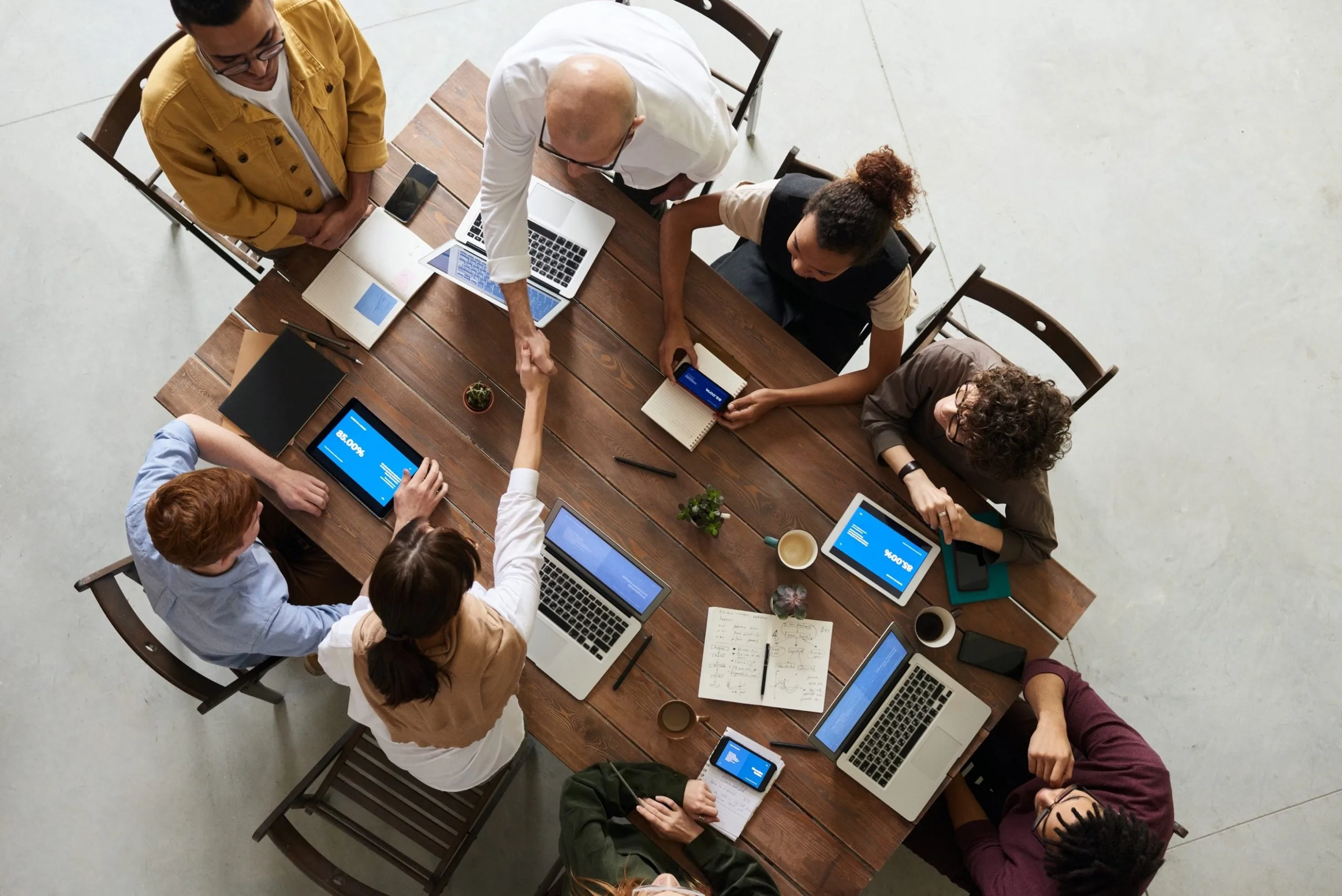 Business professionals reviewing plans and performance together