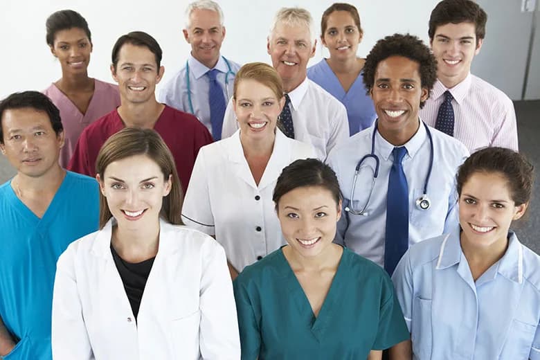 Health professionals caring for a patient in a clinical setting